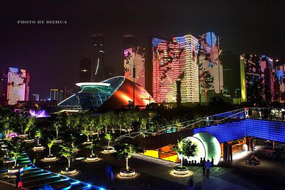 a view of a city at night with buildings