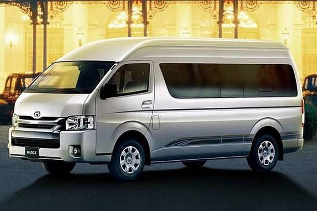 a silver van is parked in a parking lot