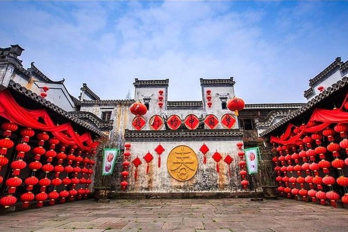 a building with red decorations on the side of it