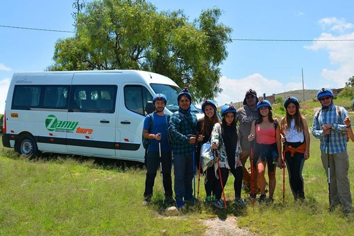 a group of people standing in front of a van