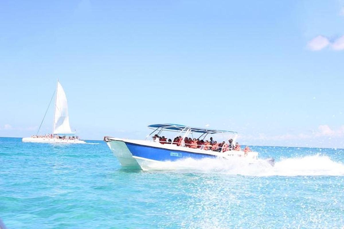 a group of people on a boat in the water