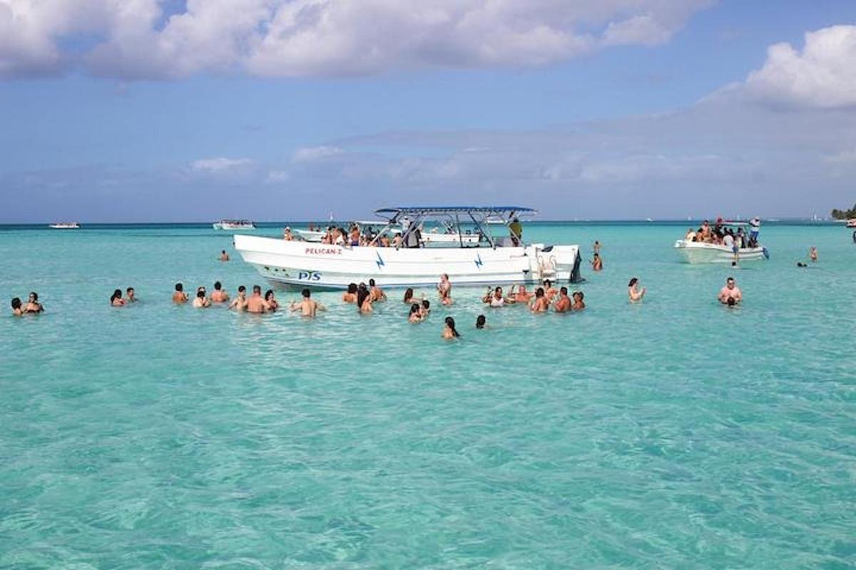 a group of people in the water near a boat