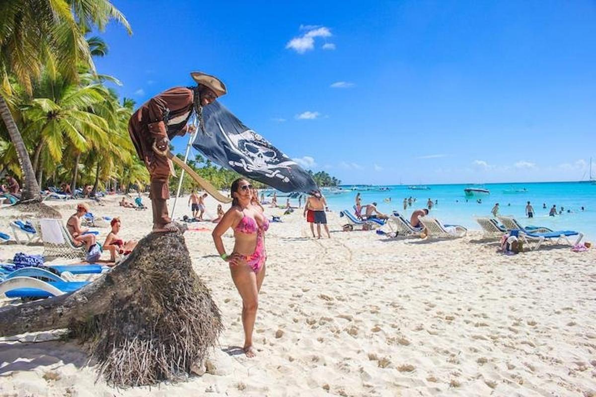 a man and a little girl on a beach