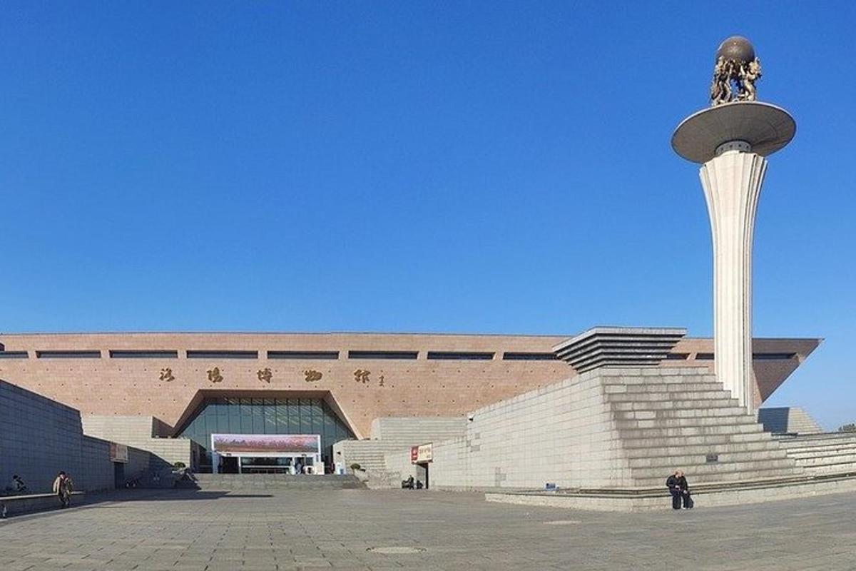 a building with a fountain in front of a building