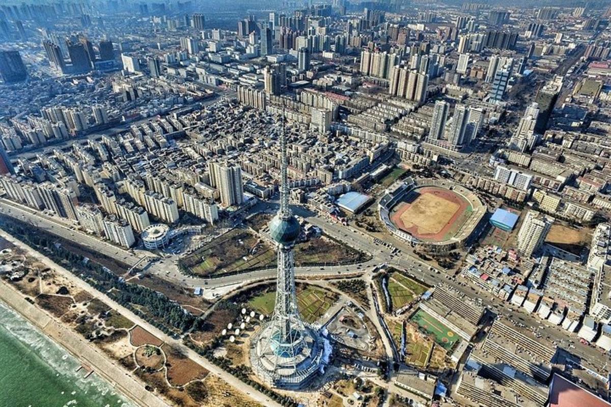 an aerial view of a city with a tower