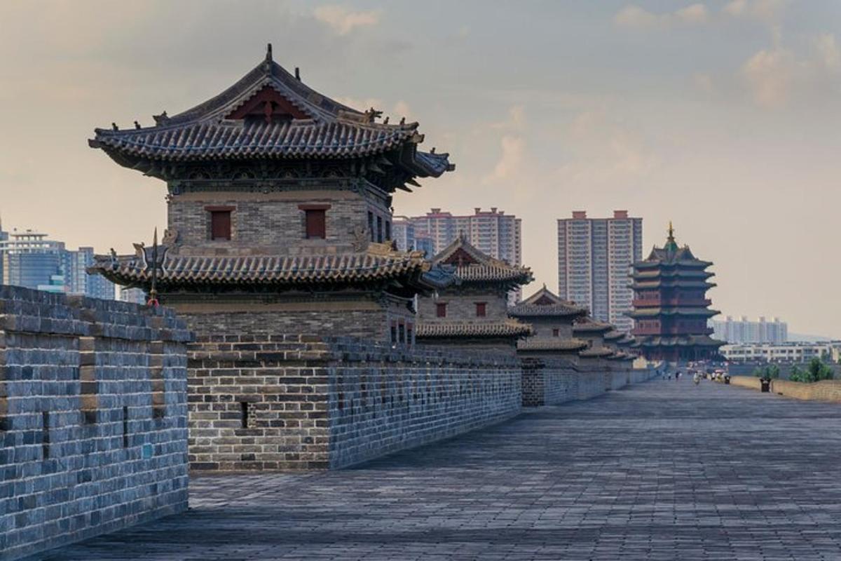 a group of buildings on top of a brick wall