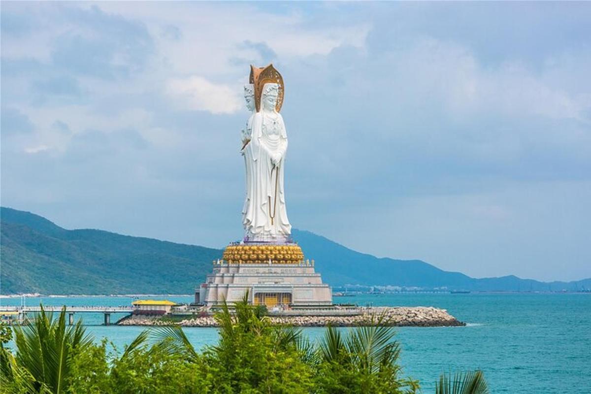 a large statue in the middle of the water