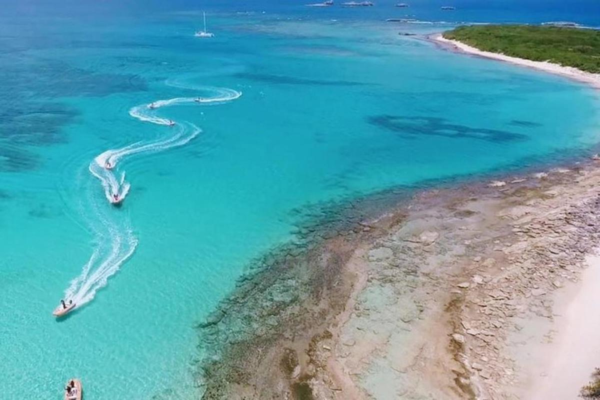 an aerial view of two boats in the ocean