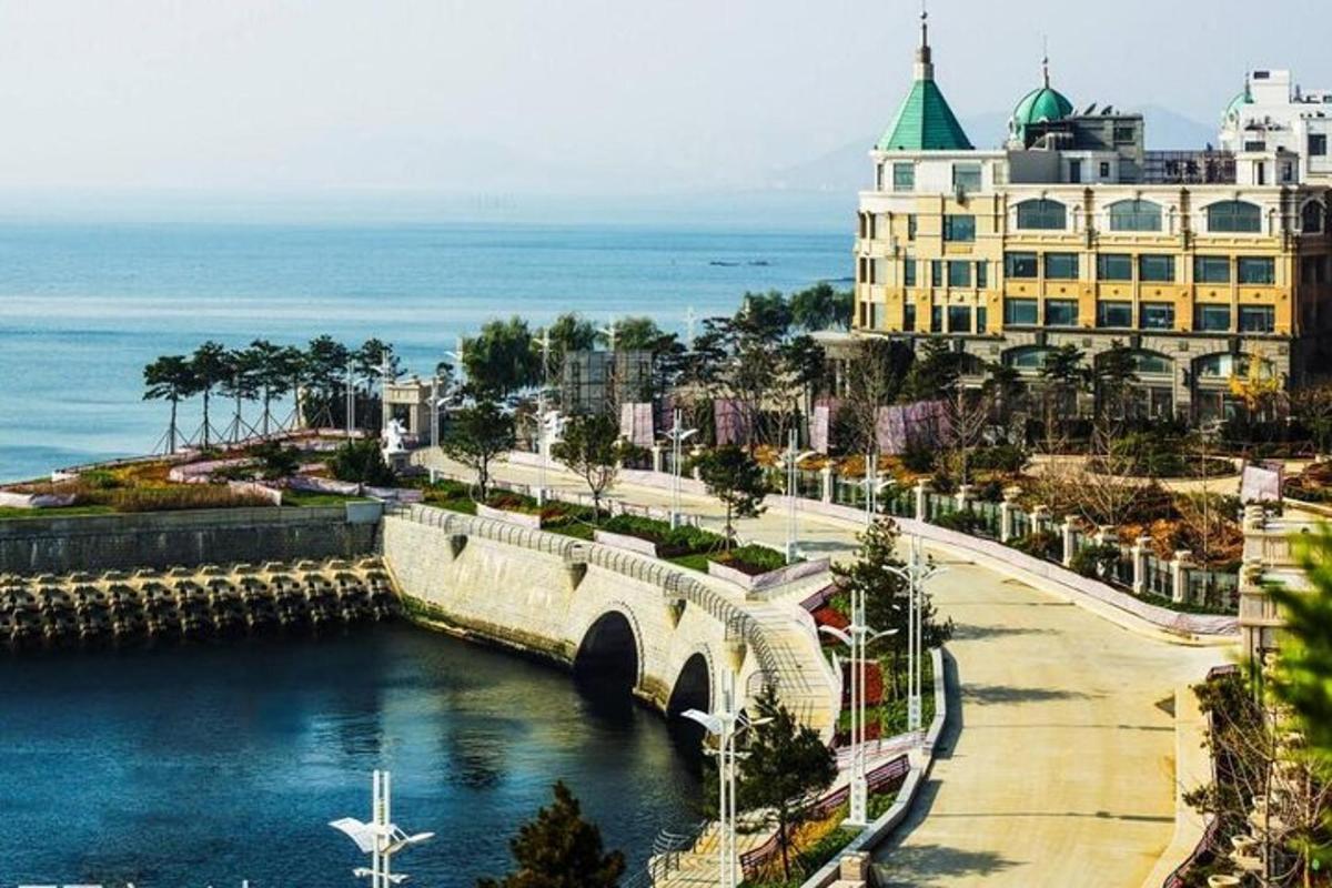a bridge over a river in front of a building