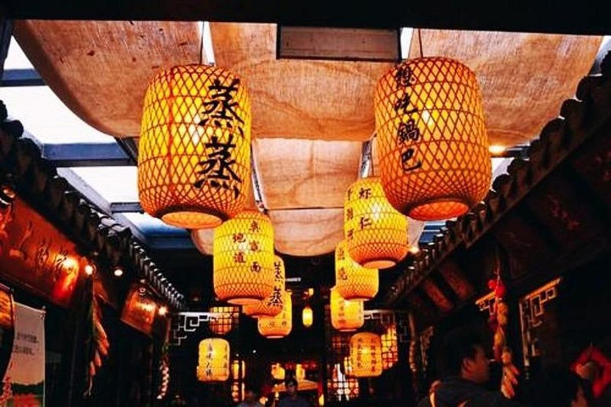 a store with chinese lights hanging from the ceiling