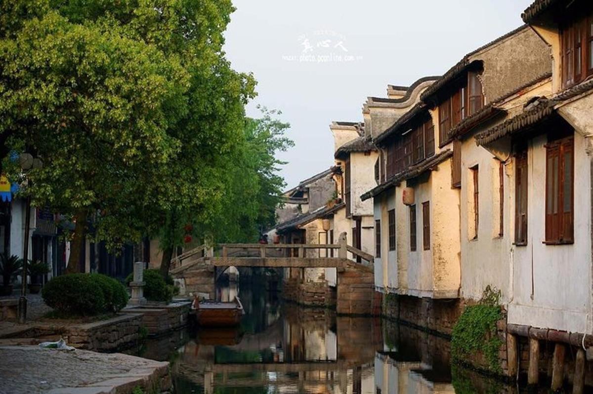 a canal in a city with buildings and water