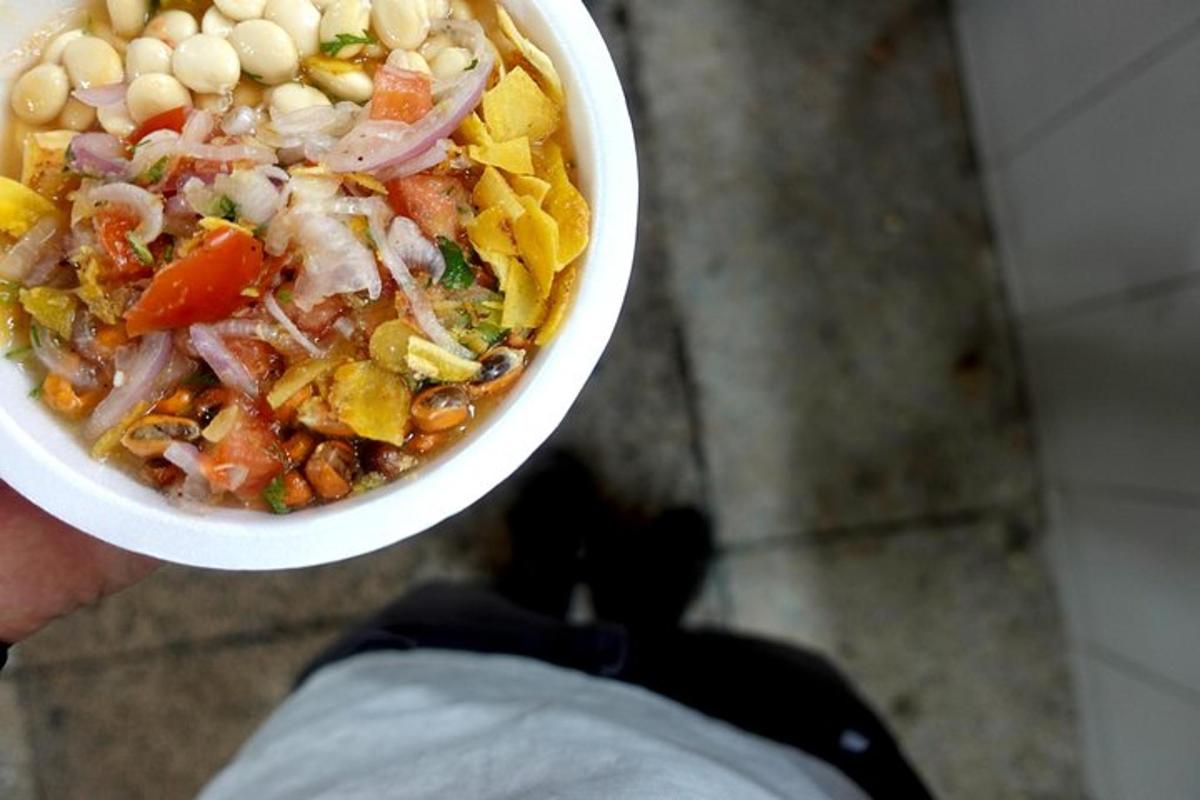 a person is holding a bowl of food