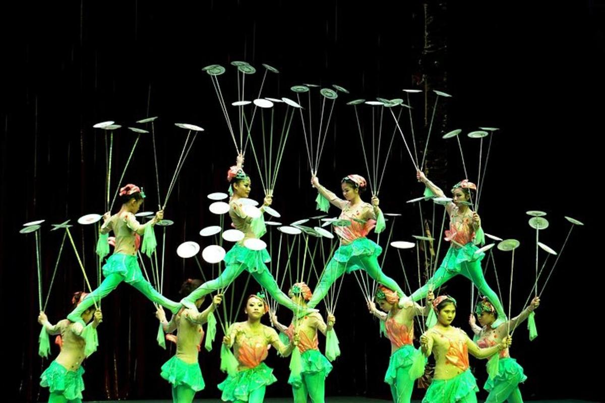 a group of women performing a routine on stage
