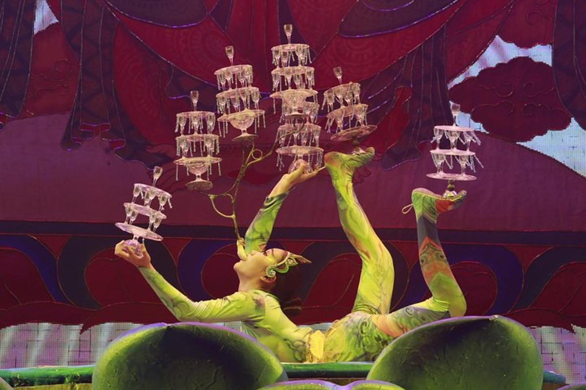 a puppeteer is holding up a chandelier