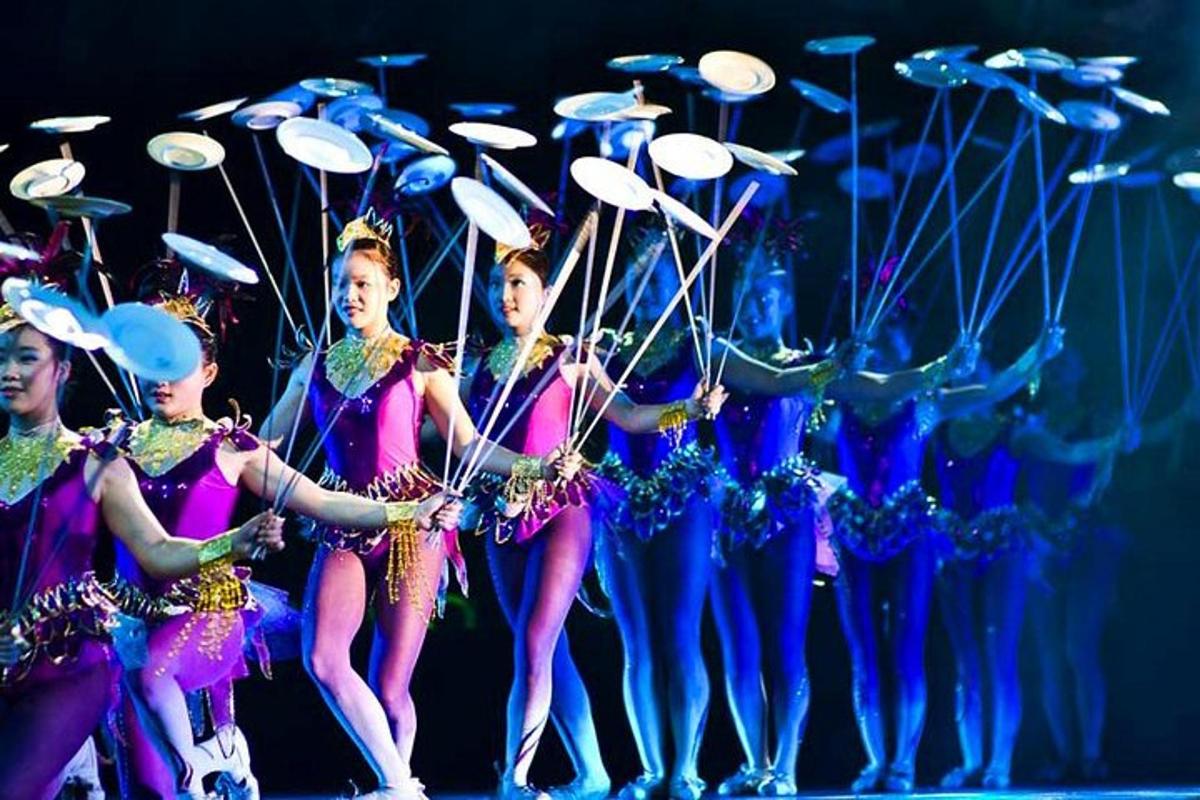 a group of women performing in a performance with drums
