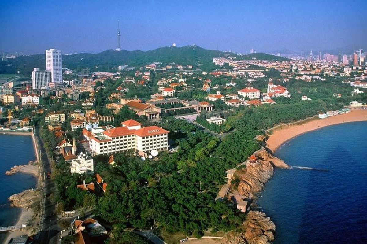an aerial view of a city and a beach