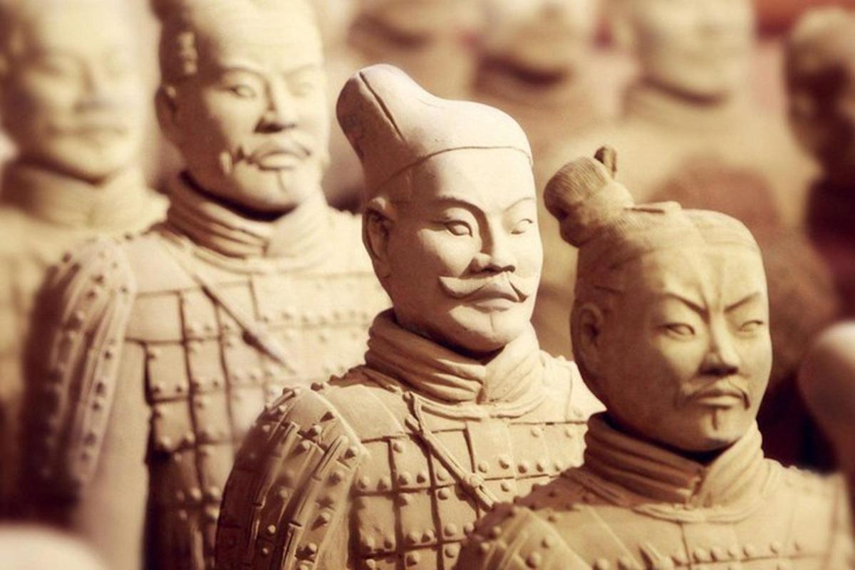 a group of wooden statues of ancient people