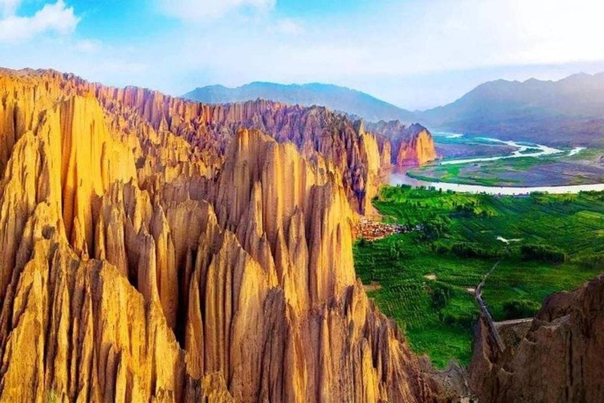 a view of a large rock mountain with a river