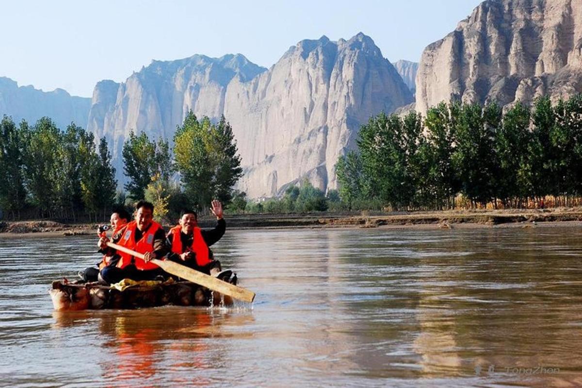 a group of people in a raft on a river