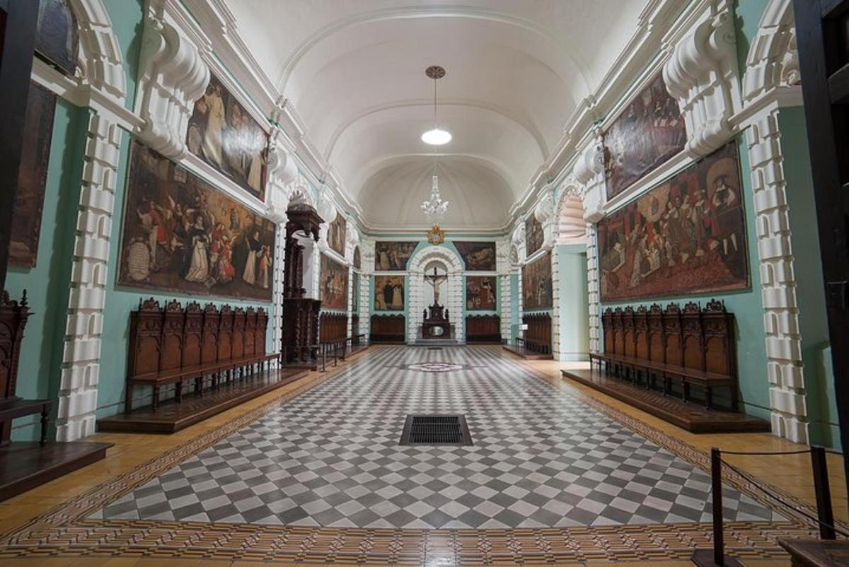 a large room with paintings on the walls and a floor