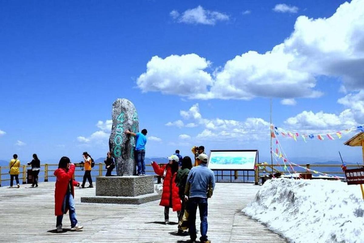 a group of people standing around a statue