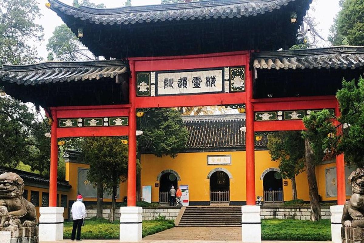 a building with a red gate in front of it
