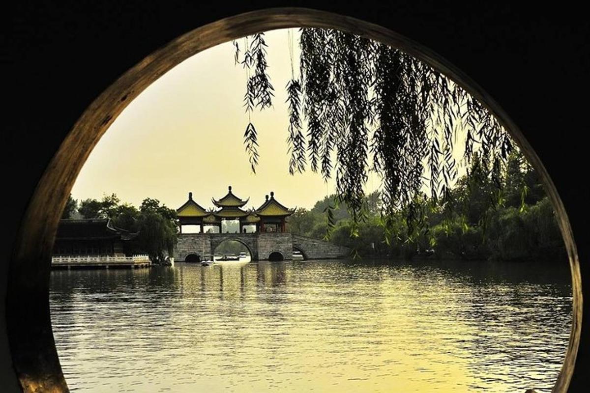 a bridge over a body of water with a building