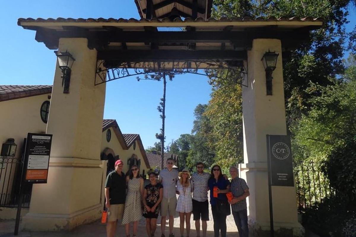 a group of people standing in front of a gate