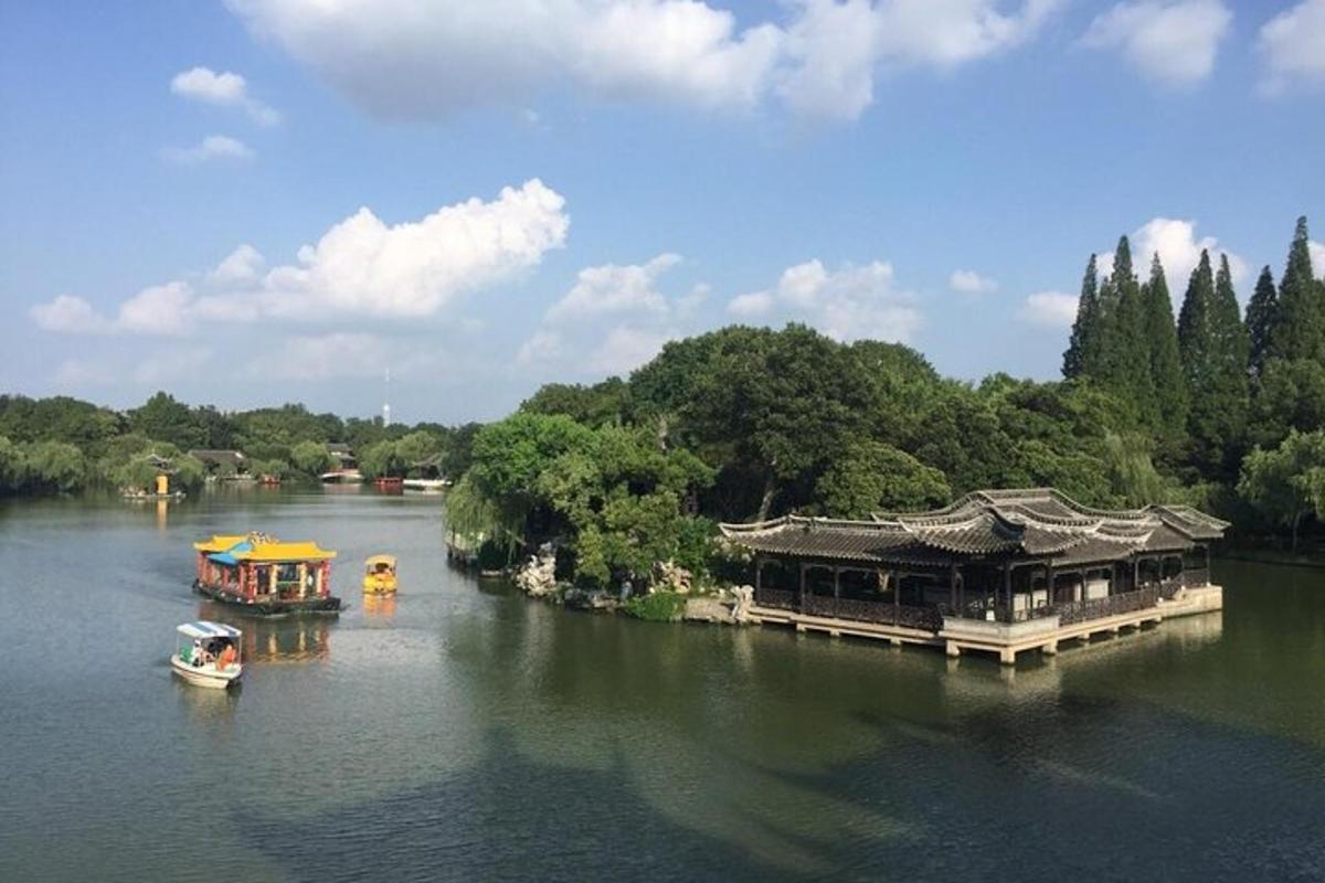 two boats on a river with buildings on it