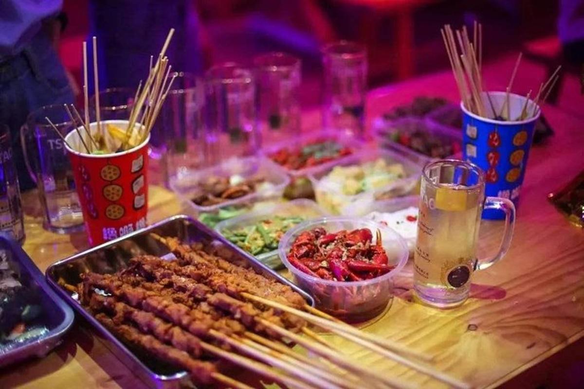 a table with a buffet of food and drinks