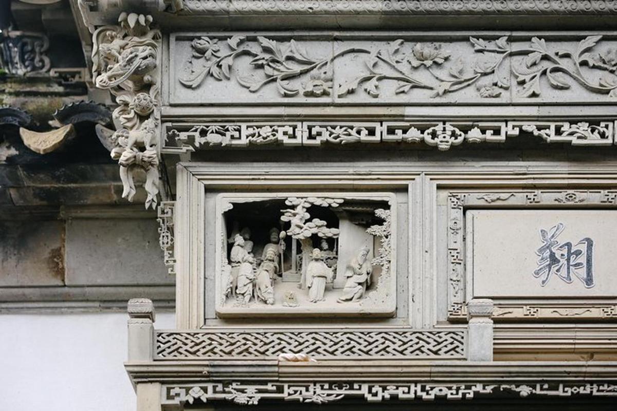 a building with a window with figurines in it