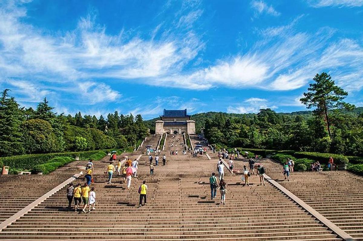 a group of people walking up some stairs