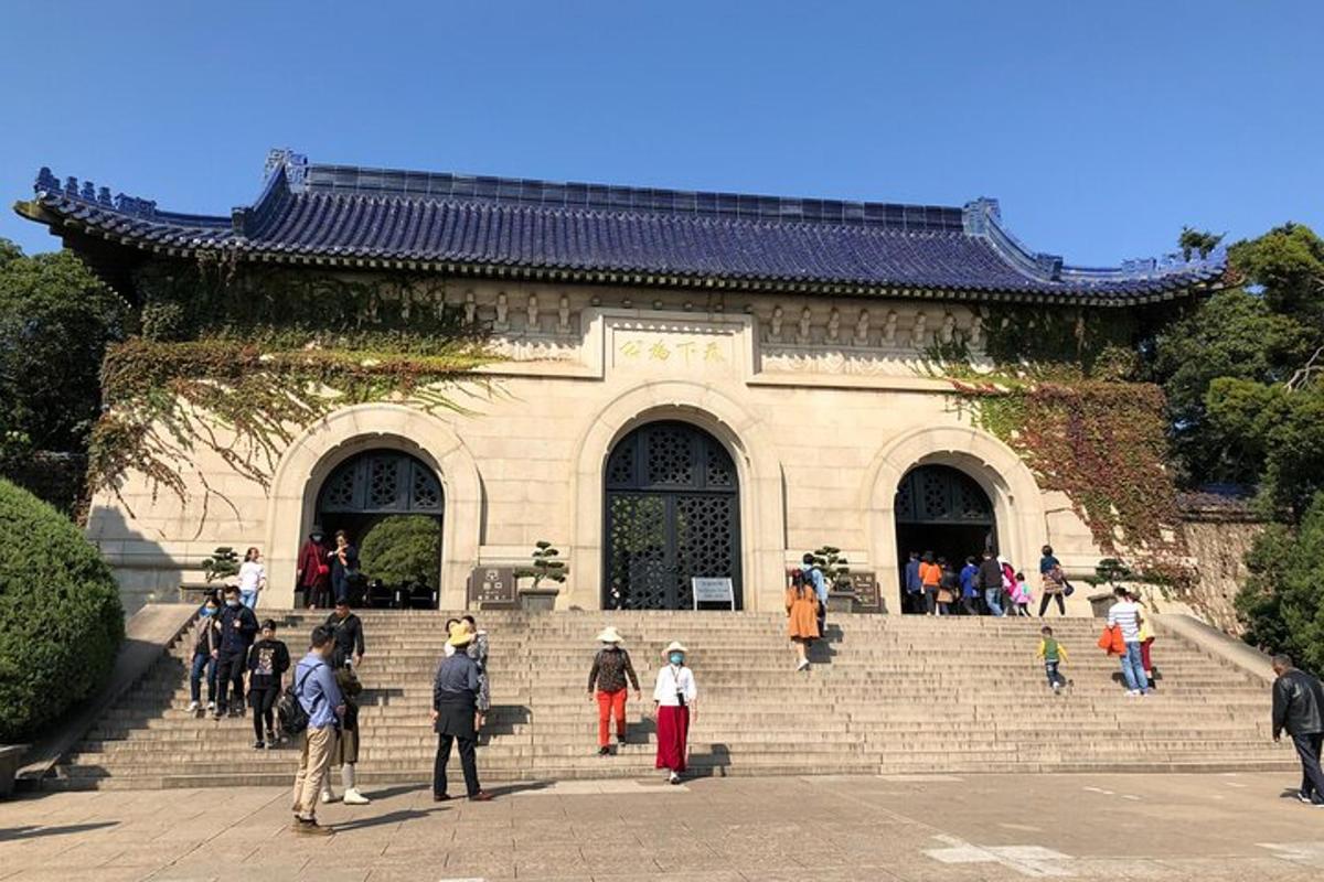 a group of people standing on steps in front of a building