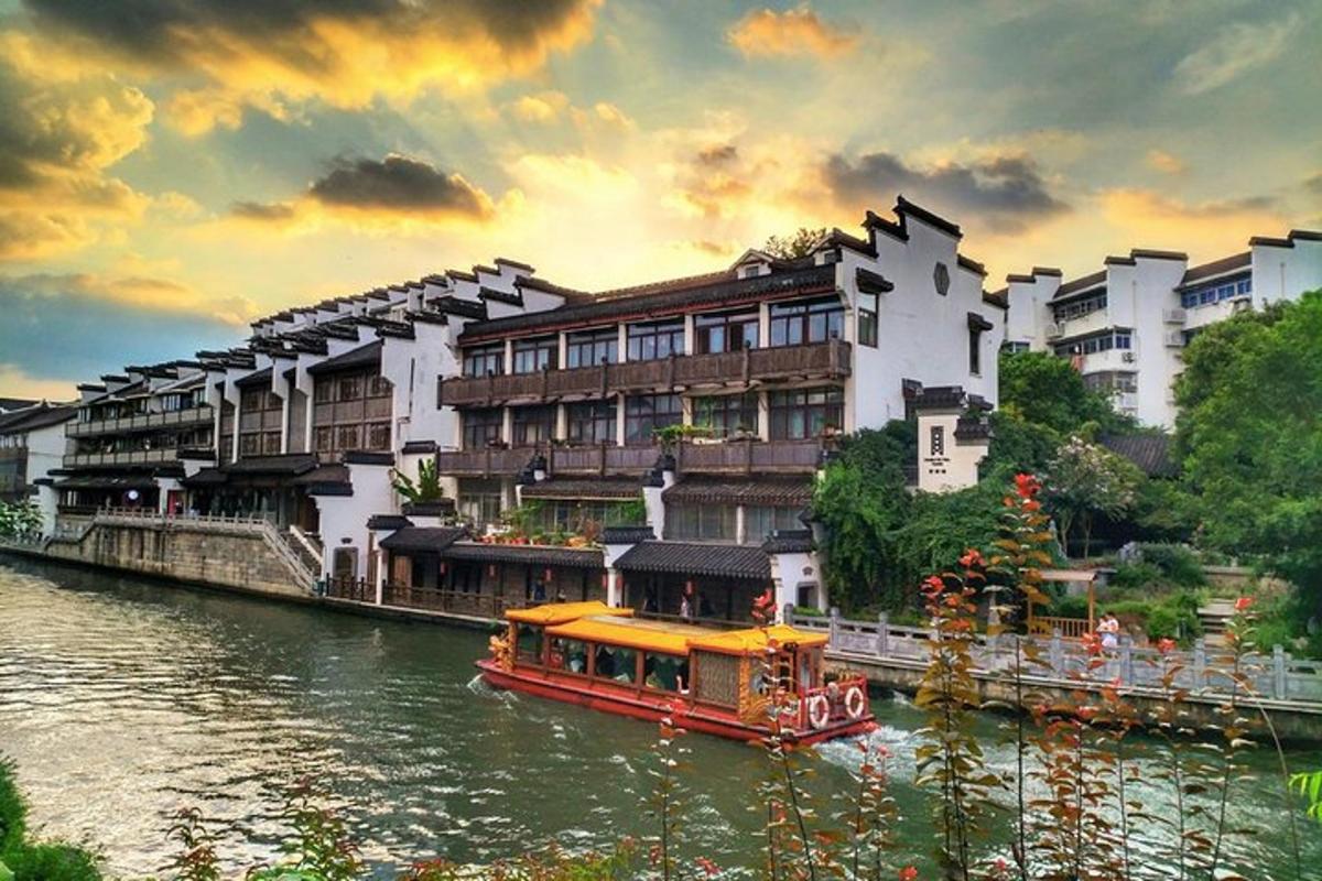 a boat in a river in front of a building