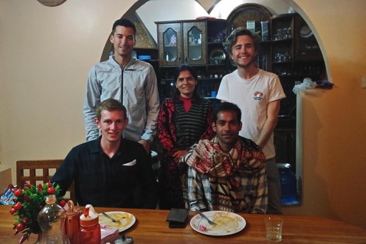 a group of men posing for a picture at a table