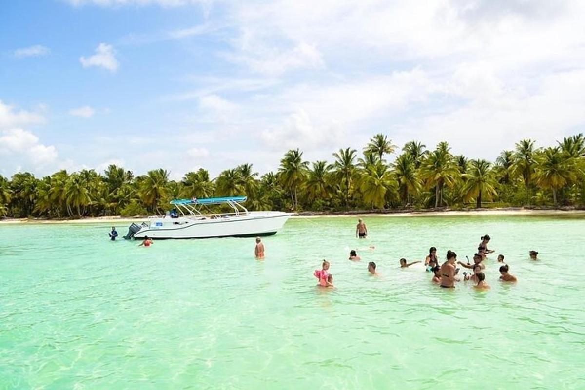 a group of people in the water with a boat