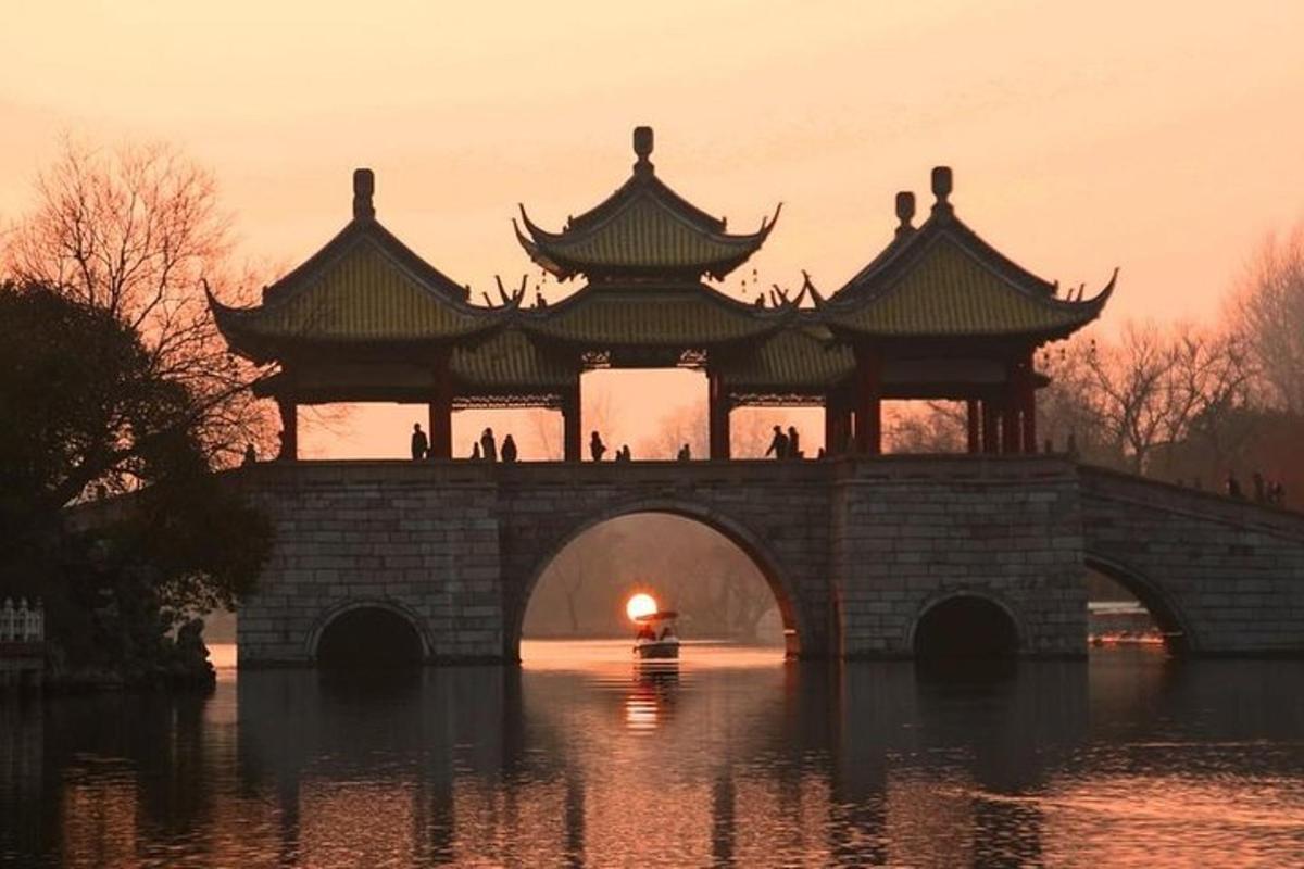 a bridge in the water with a pagoda on it