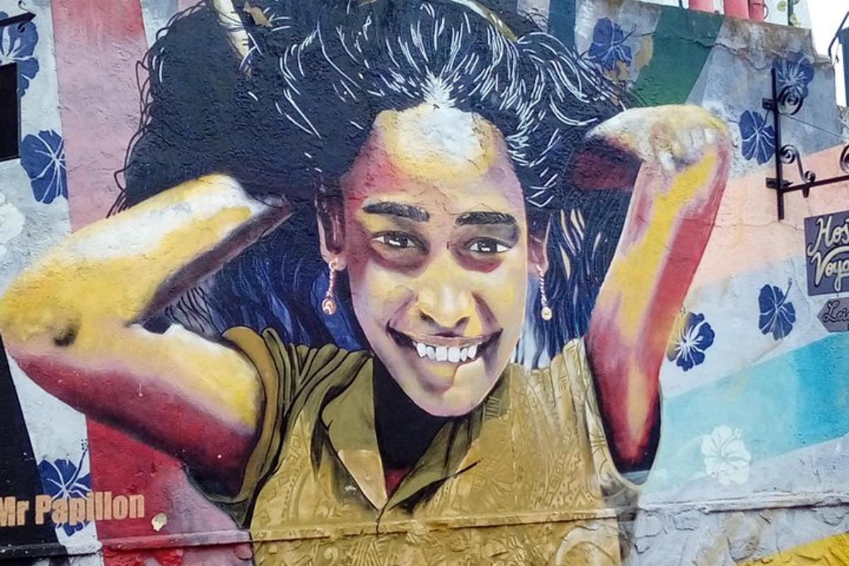 a mural of a woman painted on a wall
