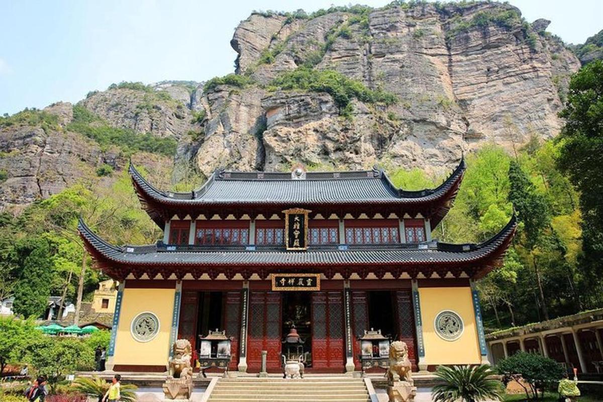 a building with a mountain in the background