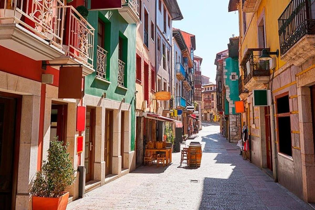 a narrow alley with colorful buildings in a city