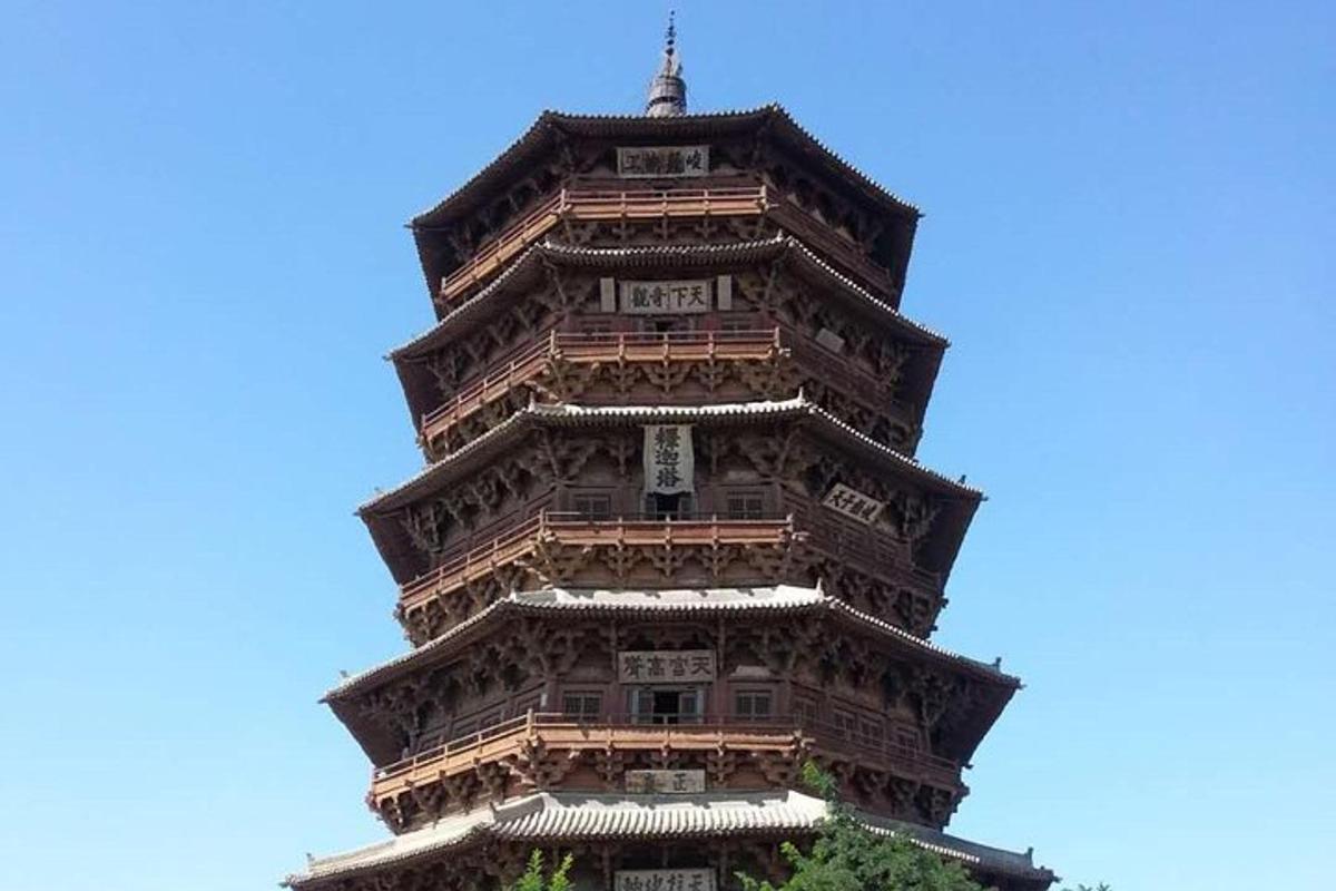 a tall building with a blue sky in the background