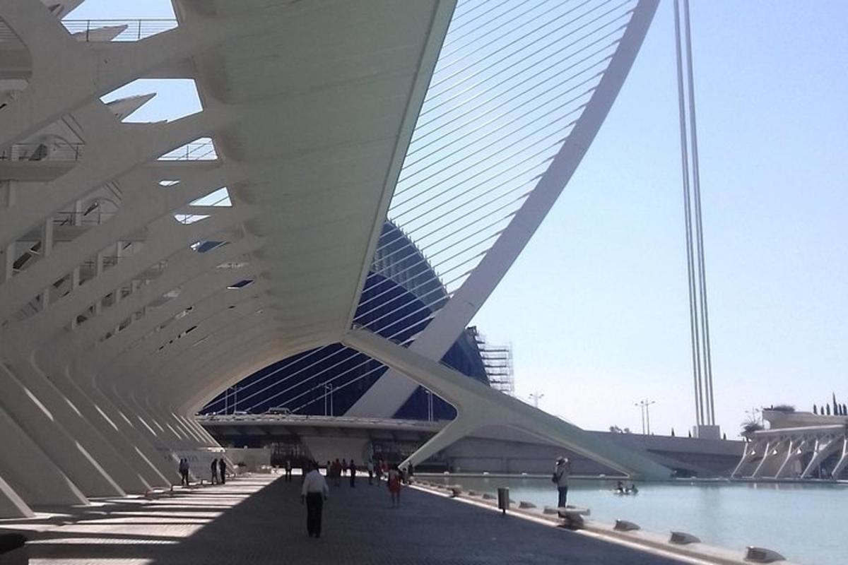 a view of a bridge with people walking under it