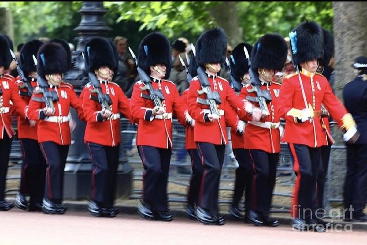 a group of soldiers in red uniforms standing in formation