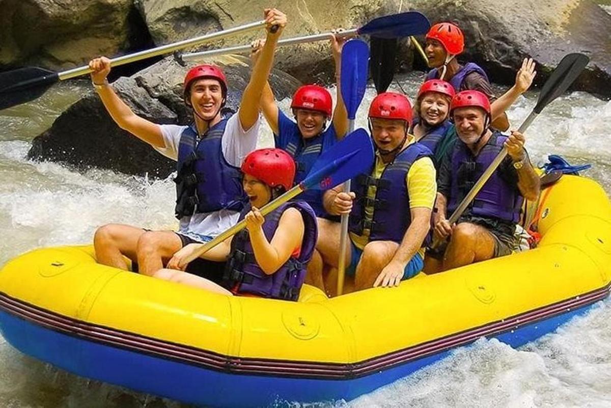 a group of people in a raft on a river
