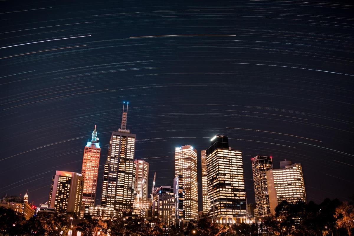 a night view of a city with tall buildings