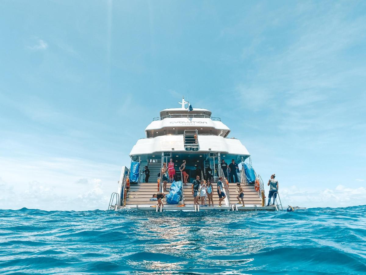 a group of people on a boat in the ocean