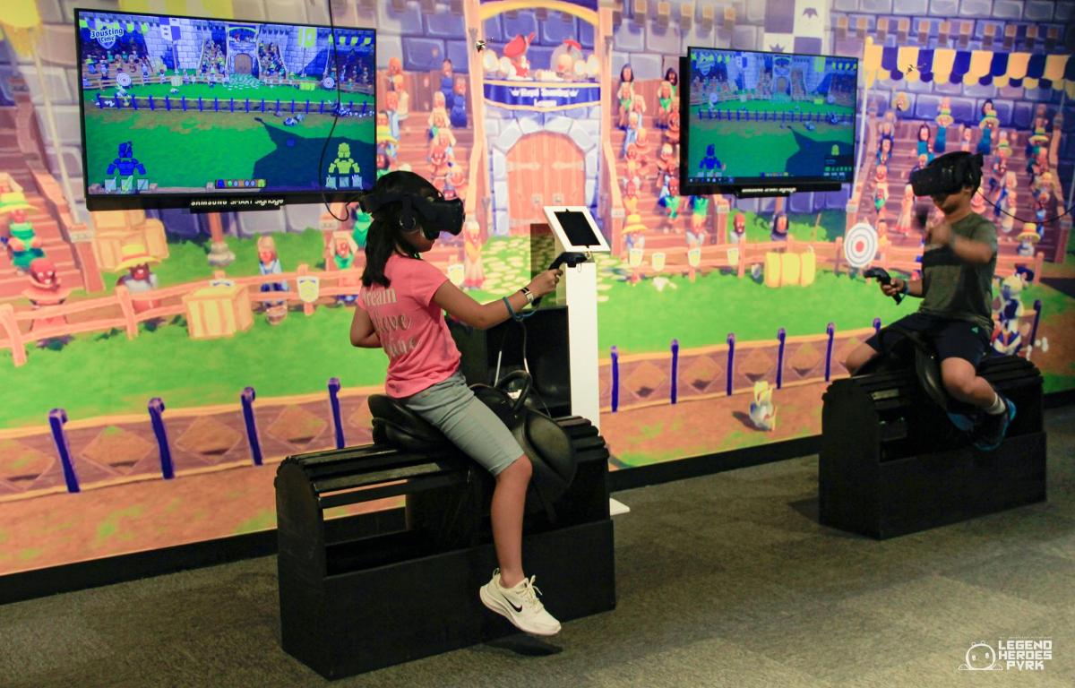 a young girl is playing a video game
