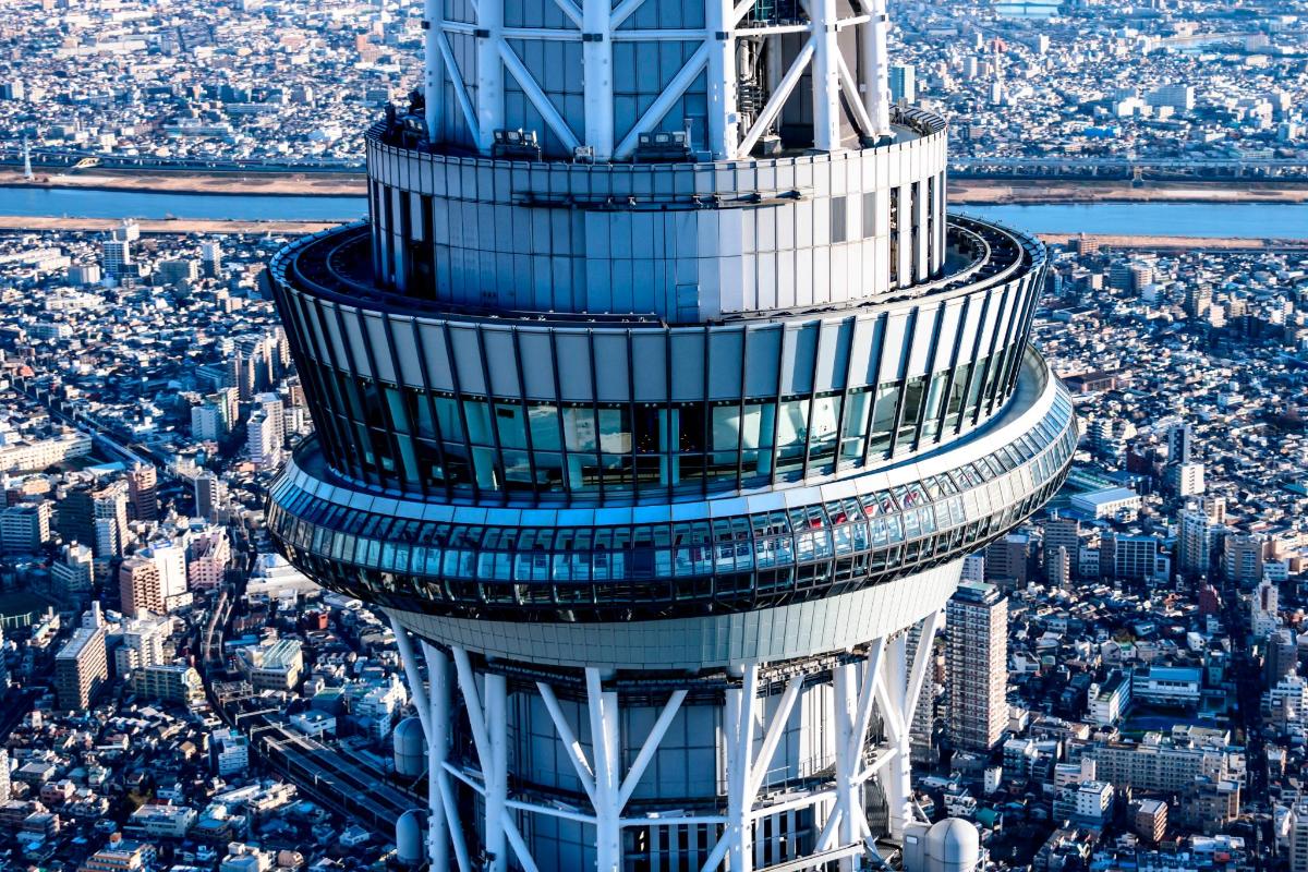 an aerial view of a tall tower in a city