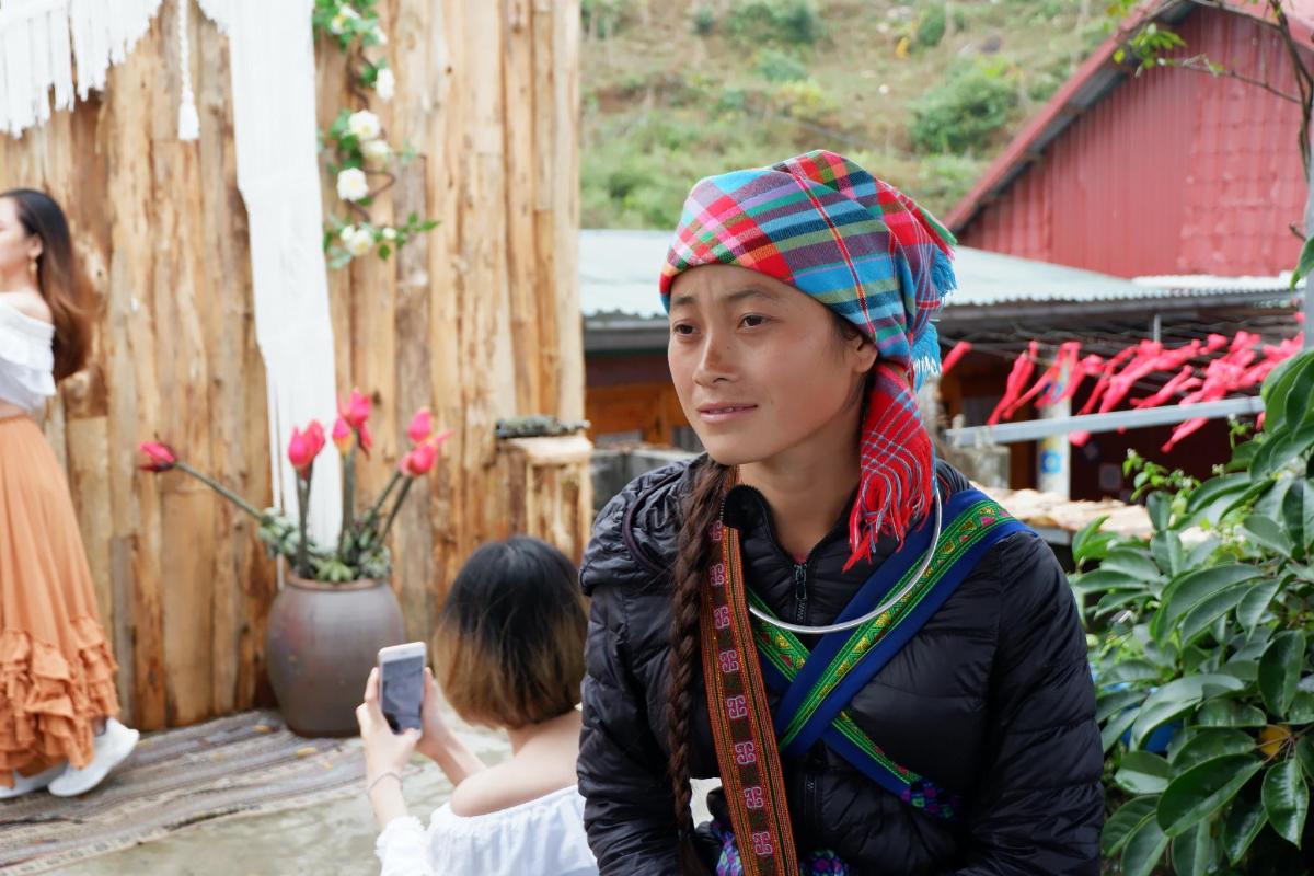 a young woman wearing a scarf on her head