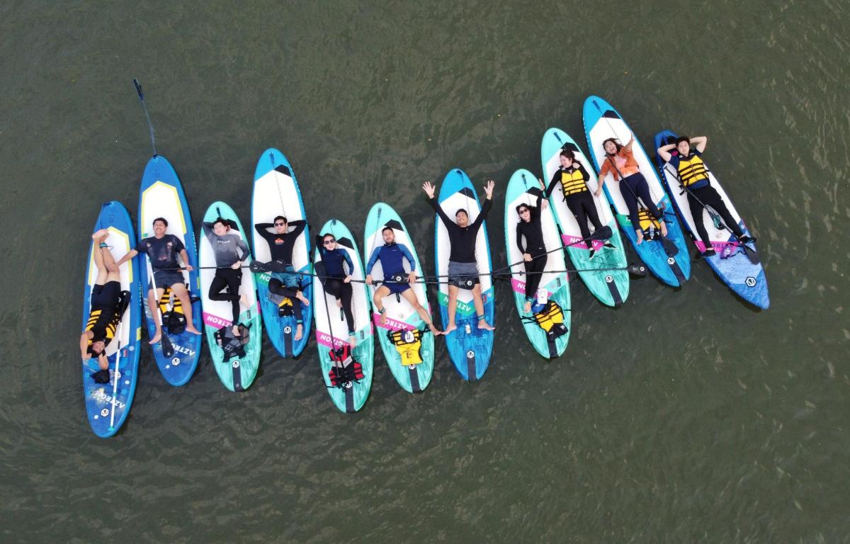 a group of people in kayaks in the water